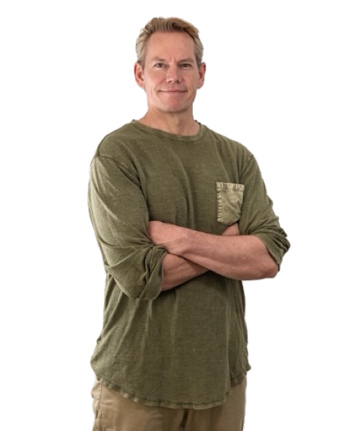 Rick Tew, arms folded, in a green shirt